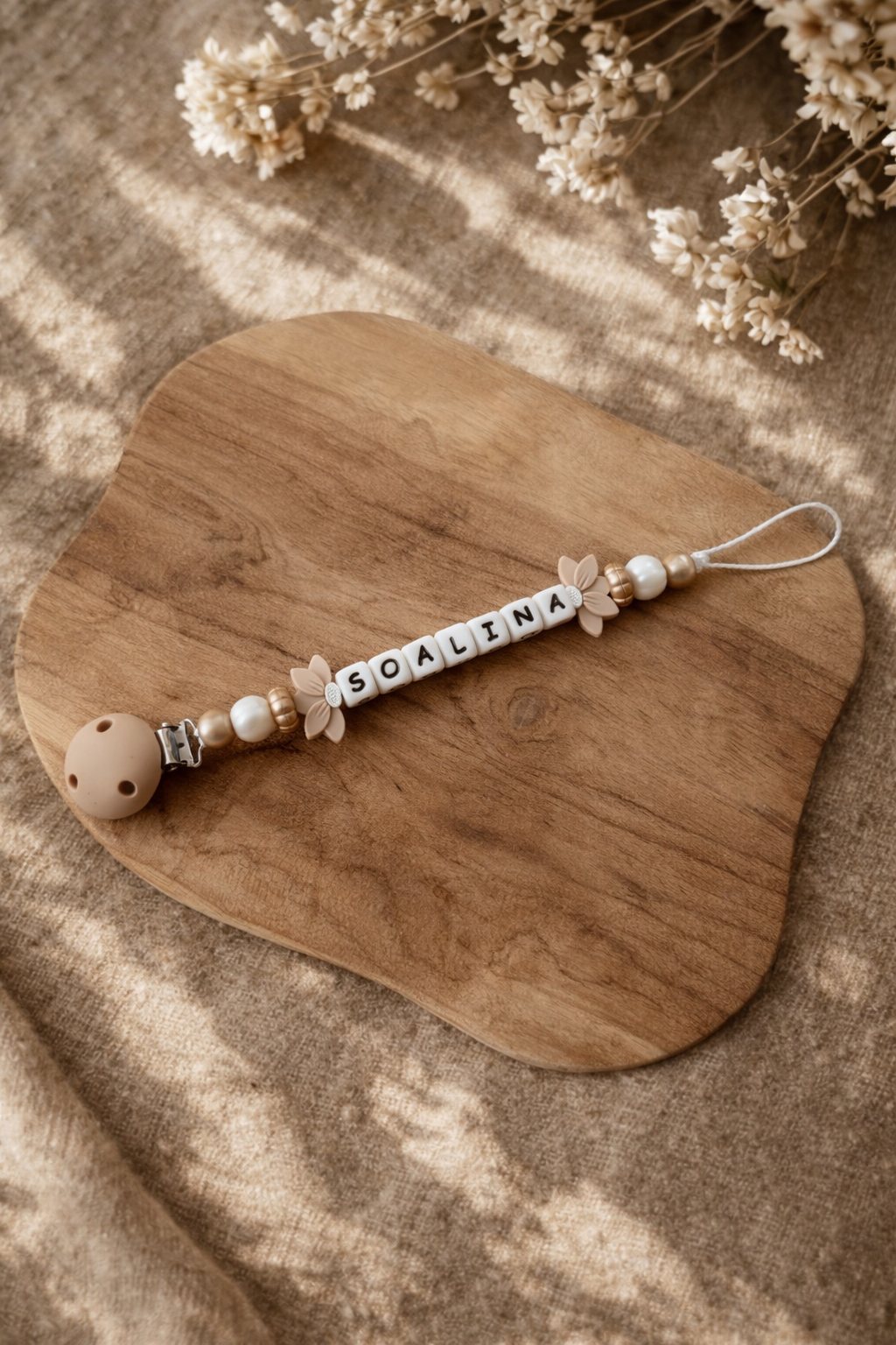 Attache tétine fleurs de lotus