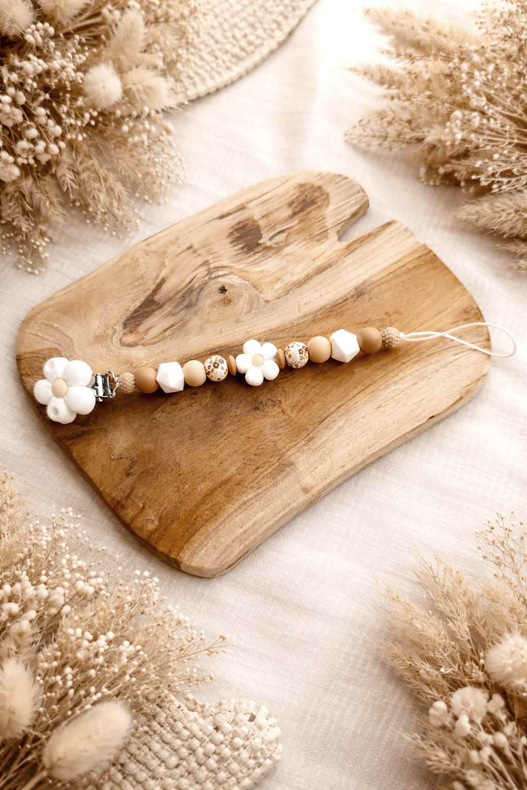 Attache tétine daisy