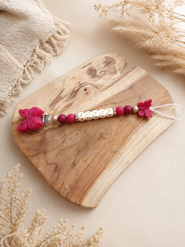 Attache tétine papillon pailleté ‹ Joyce ›