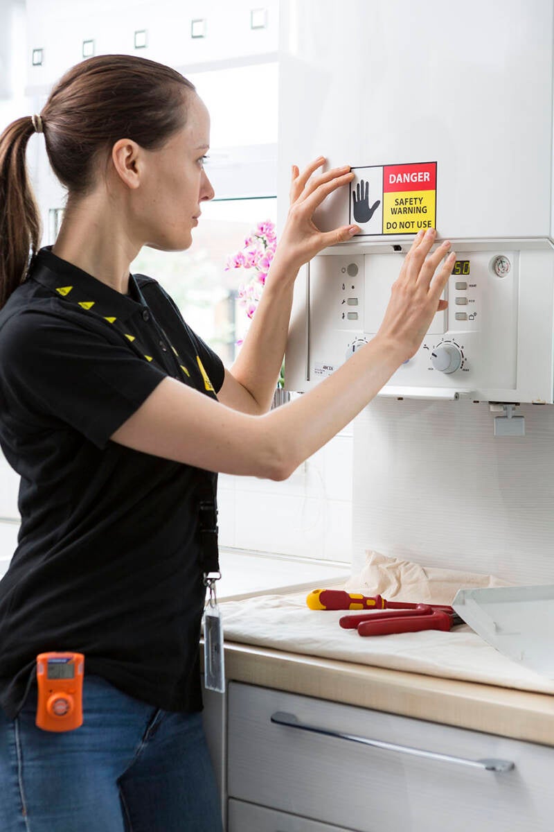 engineer-applying-unsafe-sticker-standard.jpg