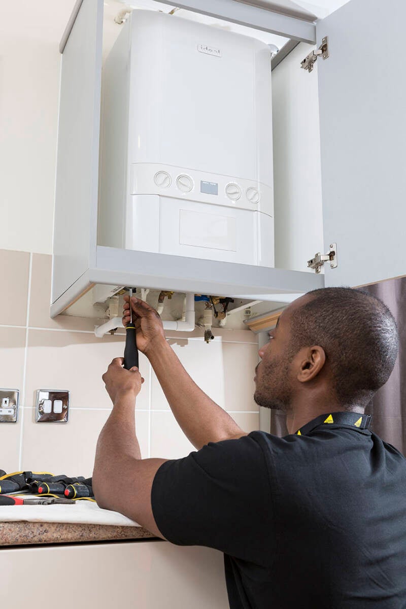 engineer-maintaining-boiler-standard.jpg