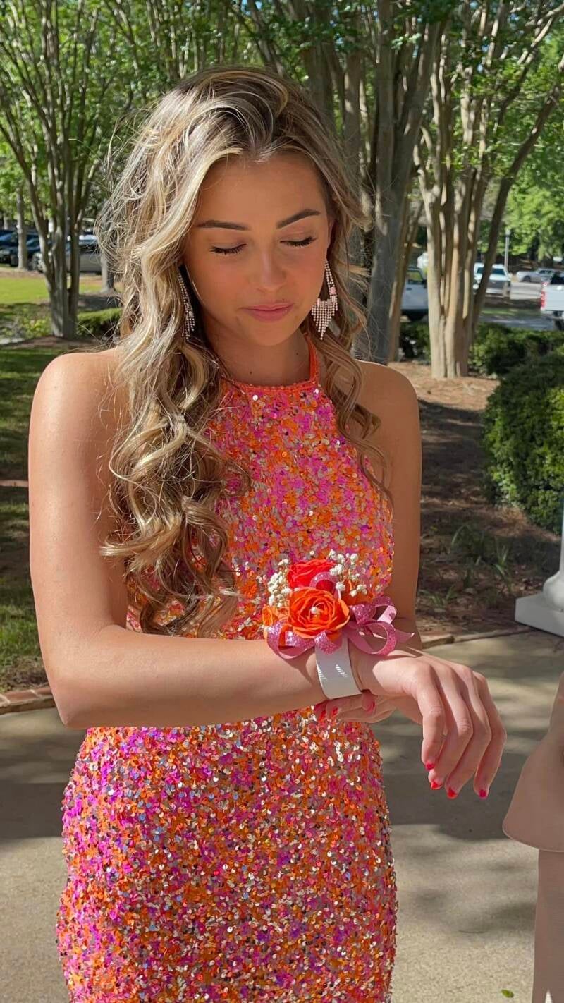 bella-looking-at-wrist-corsage-standard.jpg