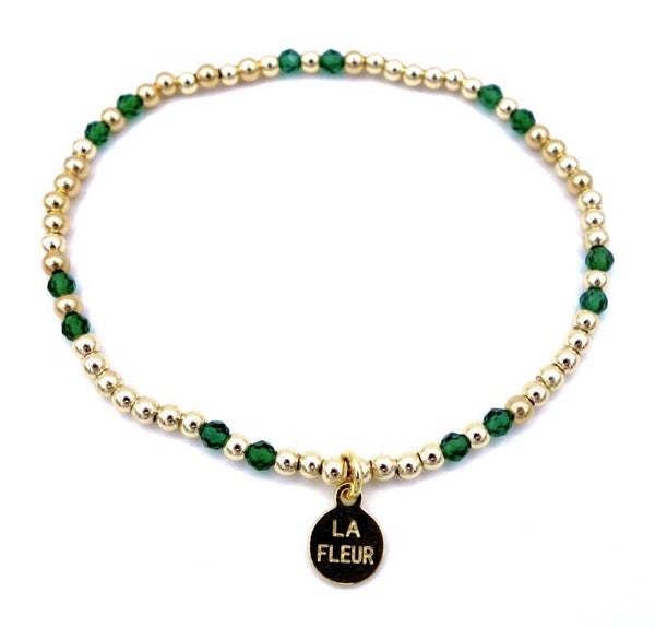 Goud met groene steentjes