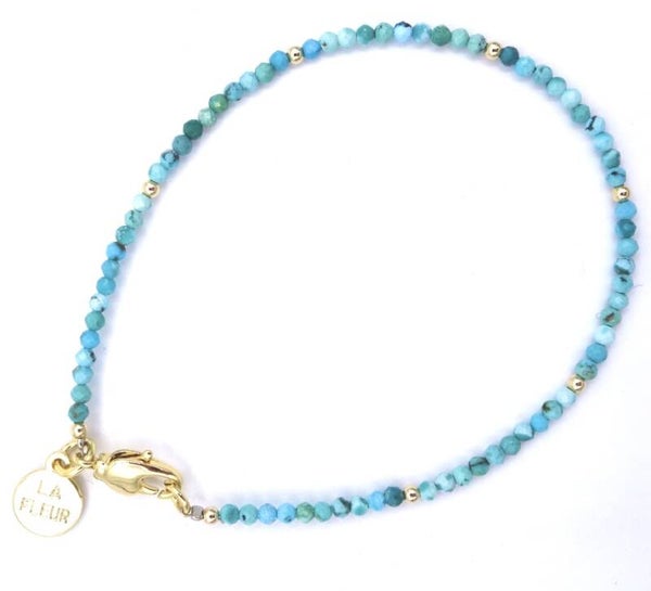 Turquoise facet geslepen met goud