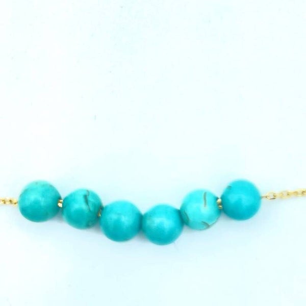 Goud met turquoise