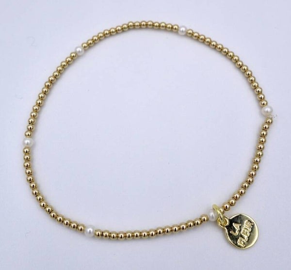 Gouden armband met kleine zoetwaterparel