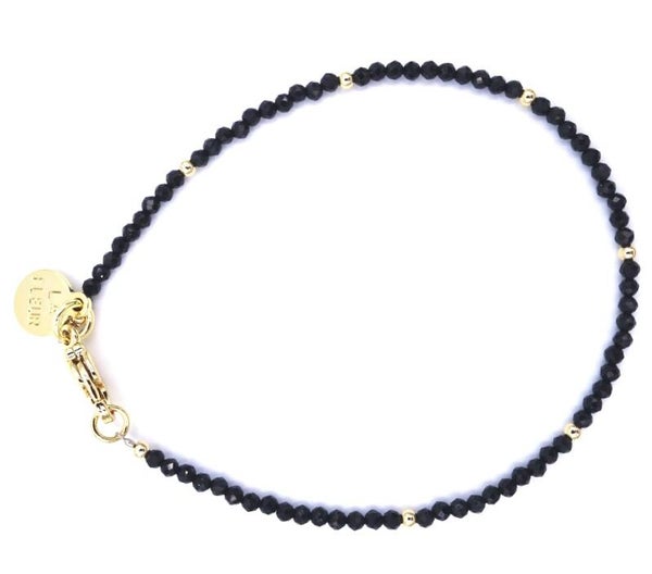 Spinel facet met goud