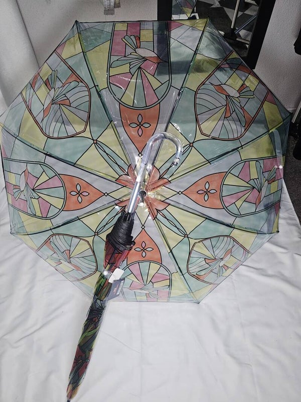 Paraguas grande transparente con dibujos de vidrieras