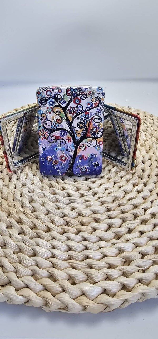 Espejo de bolso dos caras una con aumento y otra normal