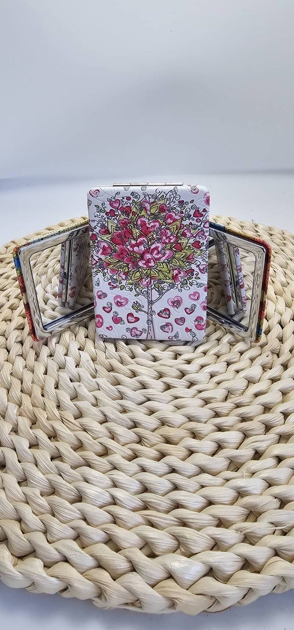 Espejo de bolso dos caras una con aumento y otra normal