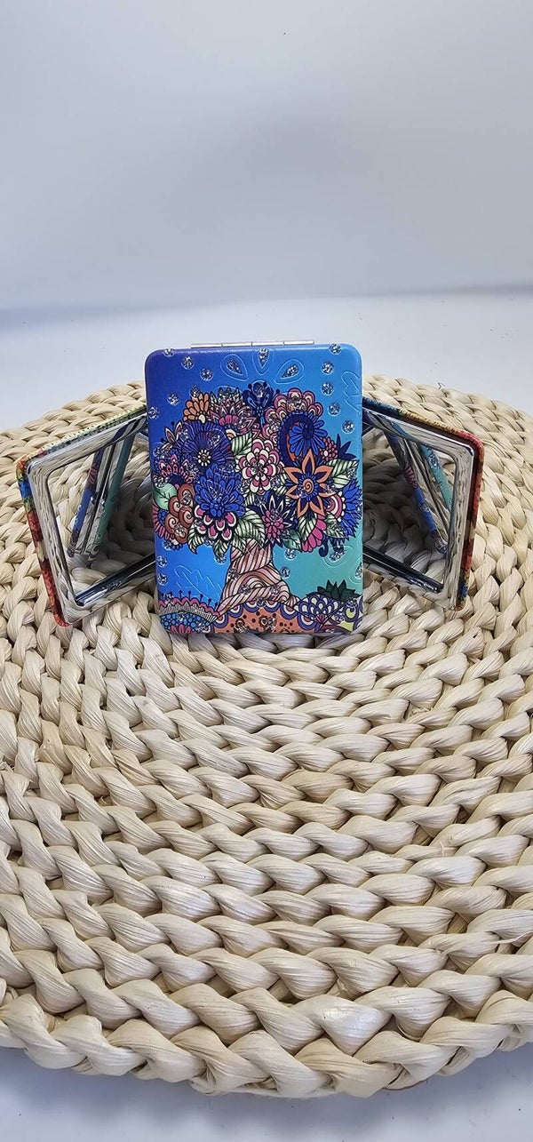 Espejo de bolso dos caras una con aumento y otra normal