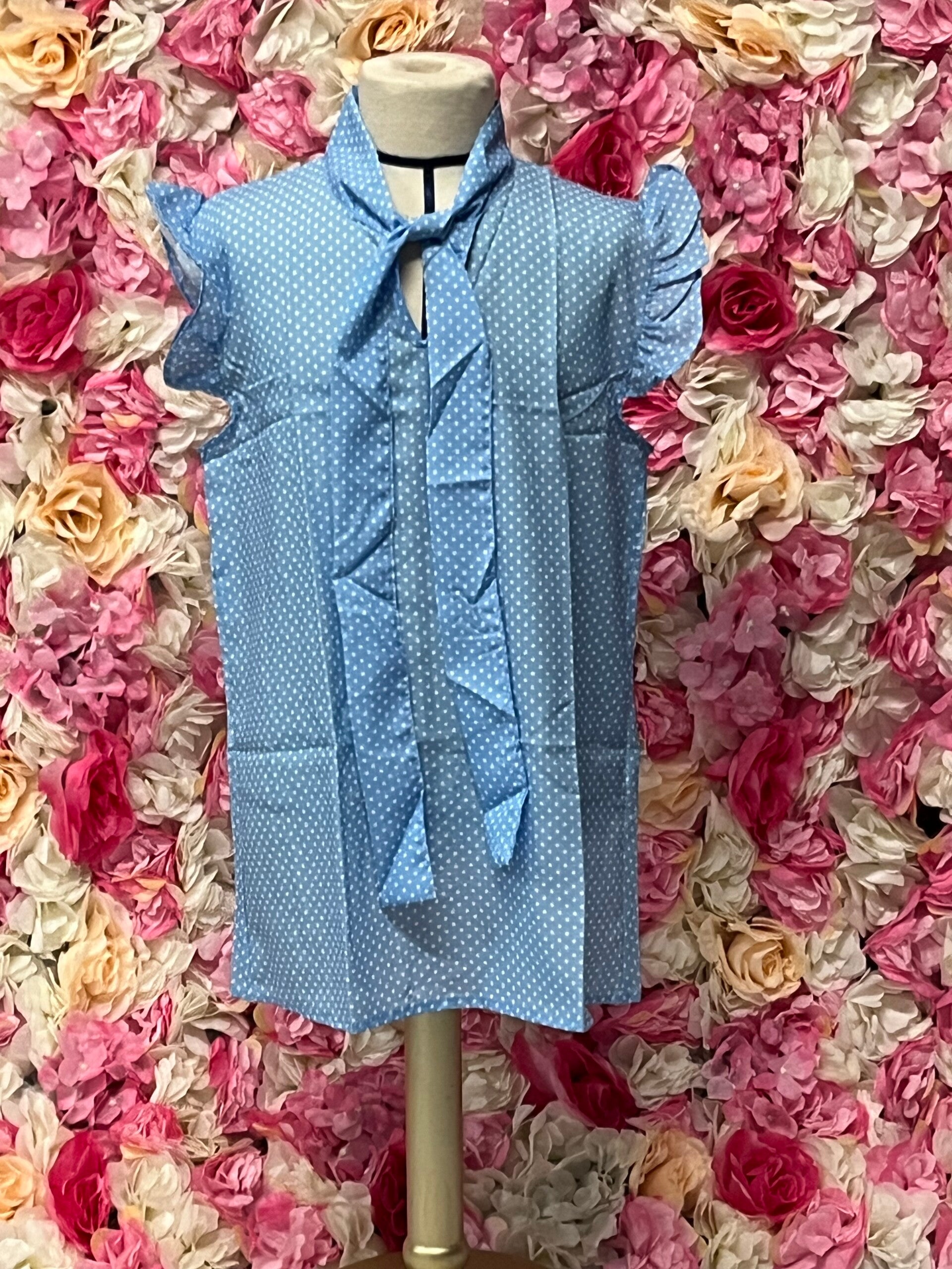 Blauwe blouse met witte stippen