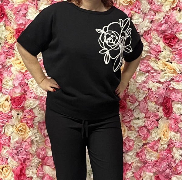 Trui met witte bloem