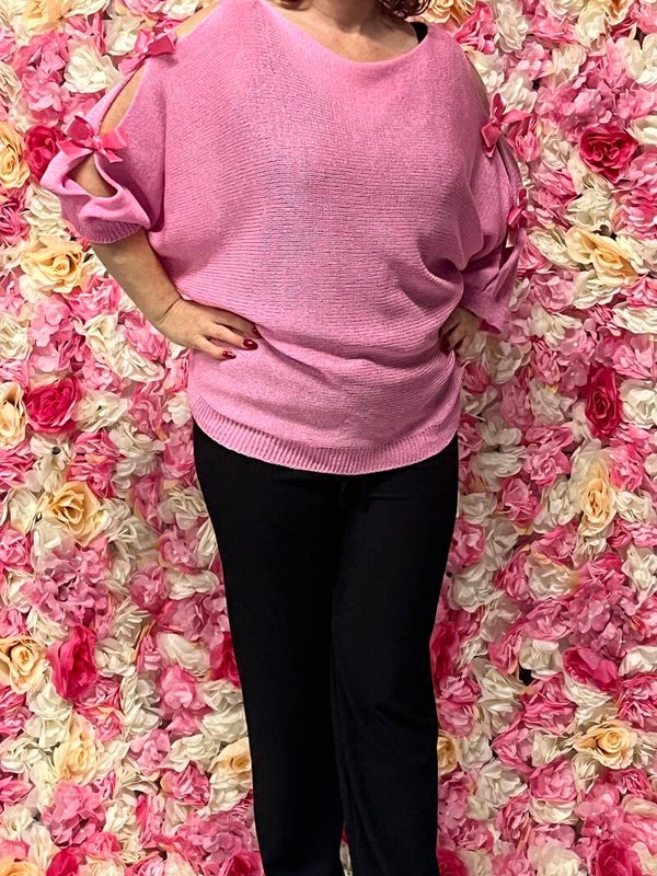 Trui met op de mouwen strikjes