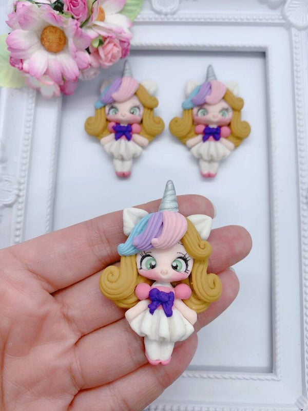 Blonde unicorn paarse strik