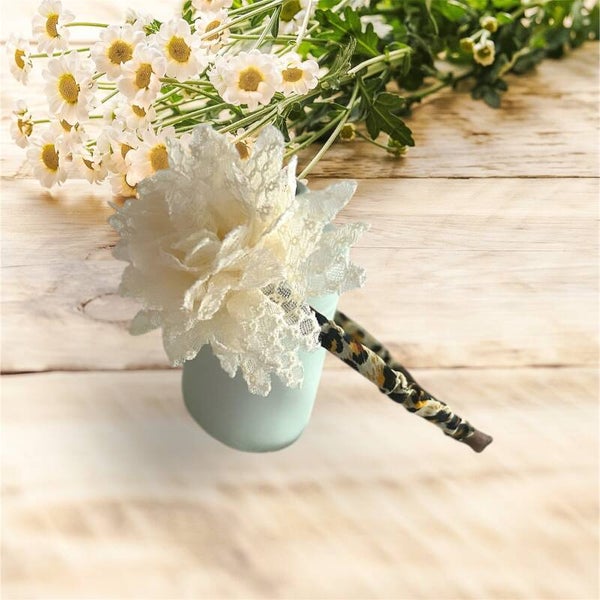 Diadeem panter print zwart met ivoor bloem