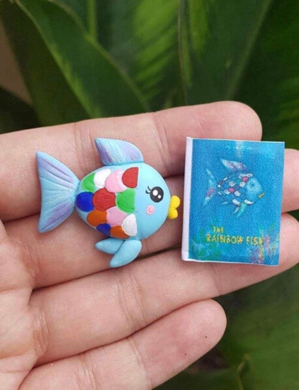 Rainbow fish with book