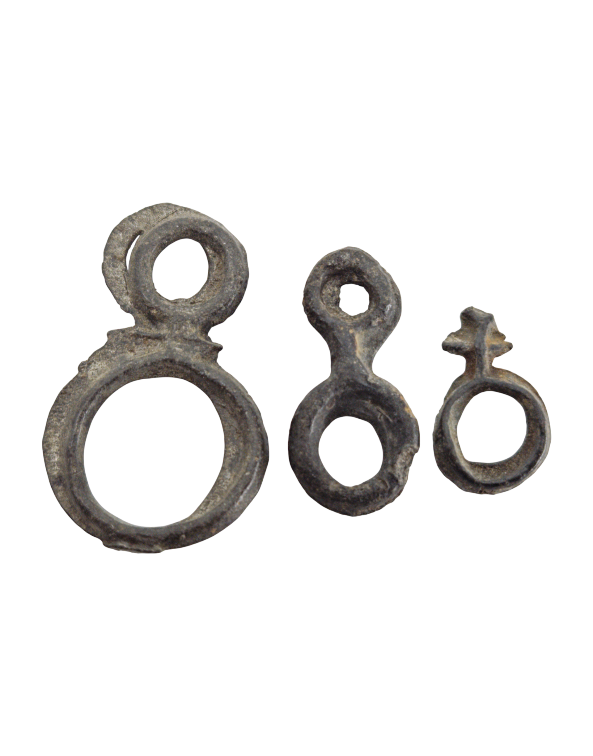 A fascinating trio of primitive Tin "Ring Money" from the Indonesian Archipelago (Majapahit to Sultanate periods, 14th - 17th Century)., itemnumber: W5146