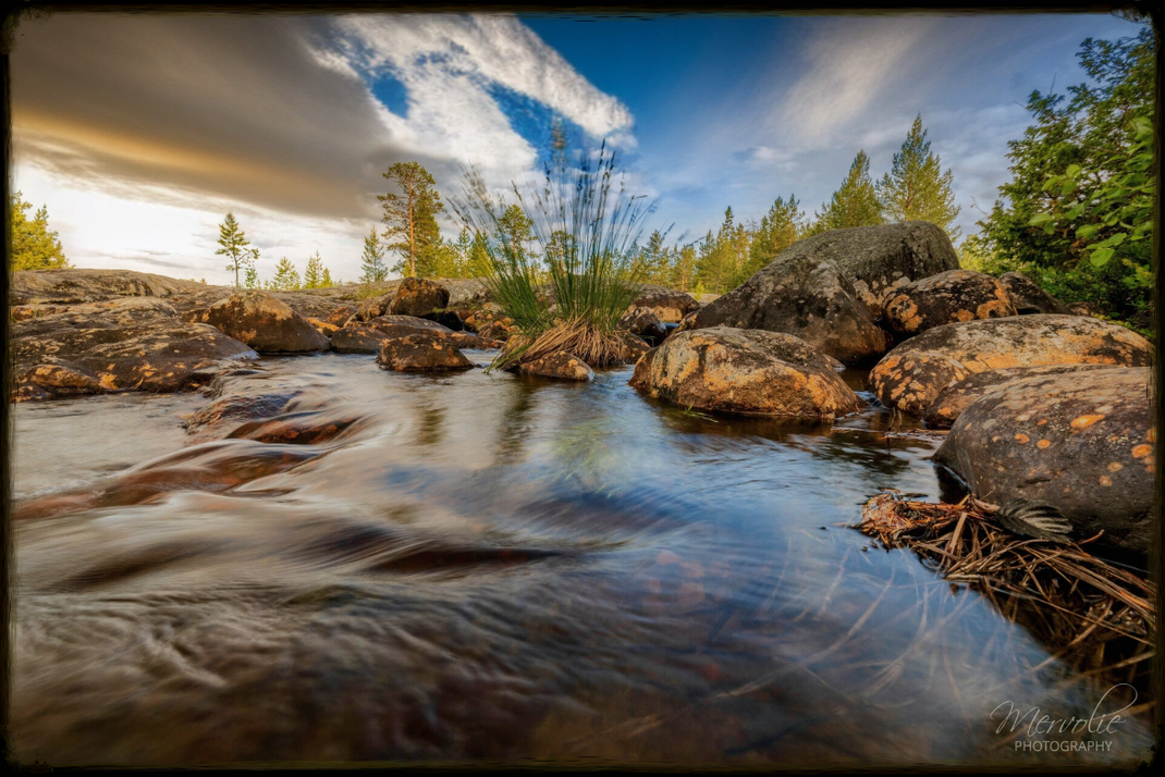 Landscape photography at Storforsen, Sweden, using long exposure to create silky water on a summer day.