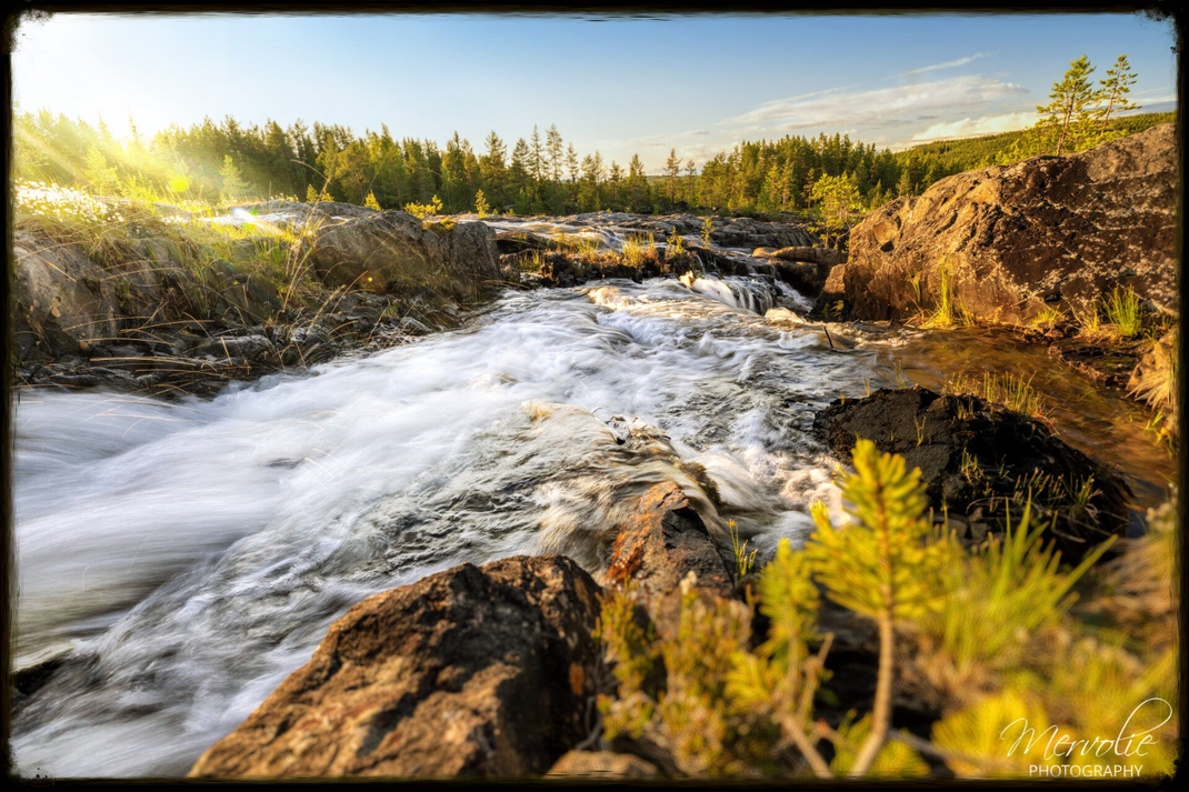 Landscape photography at Storforsen, Sweden, using long exposure to create silky water on a summer day.