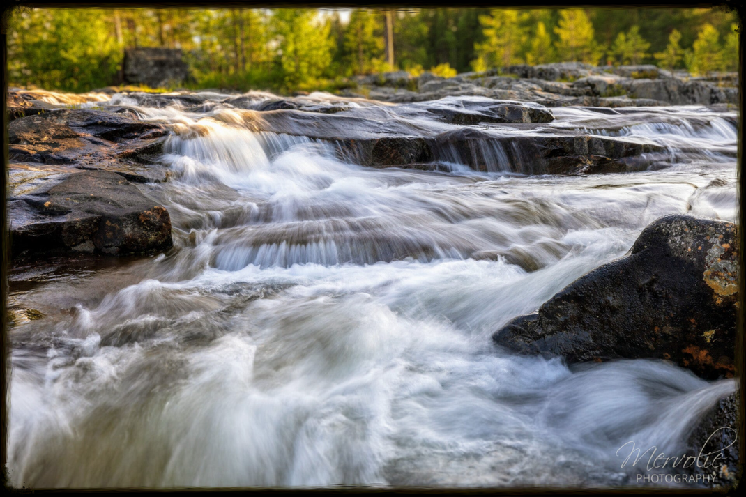 Landscape photography at Storforsen, Sweden, using long exposure to create silky water on a summer day.