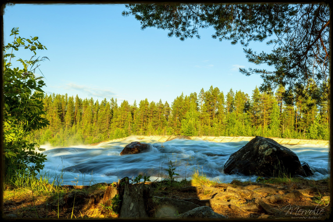 Landscape photography at Storforsen, Sweden, using long exposure to create silky water on a summer day.
