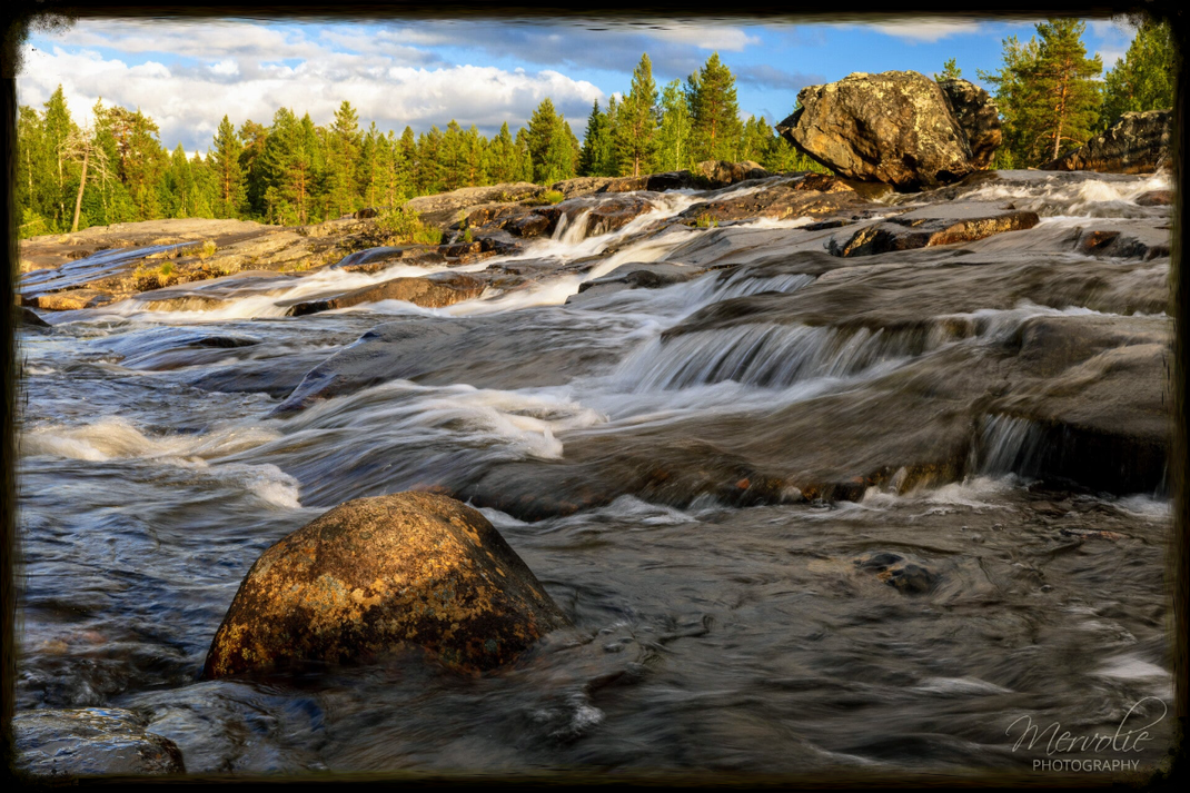 Landscape photography at Storforsen, Sweden, using long exposure to create silky water on a summer day.