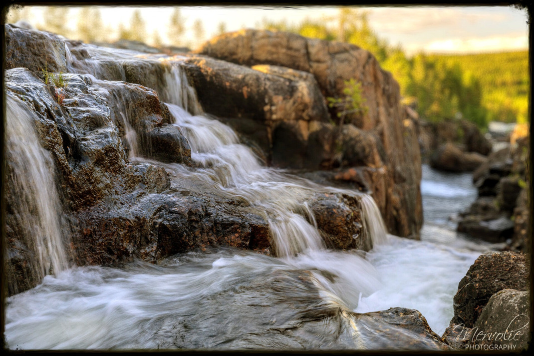 Landscape photography at Storforsen, Sweden, using long exposure to create silky water on a summer day.