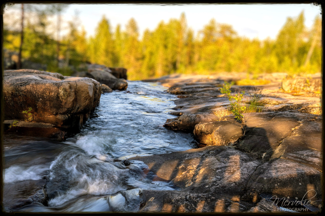 Landscape photography at Storforsen, Sweden, using long exposure to create silky water on a summer day.