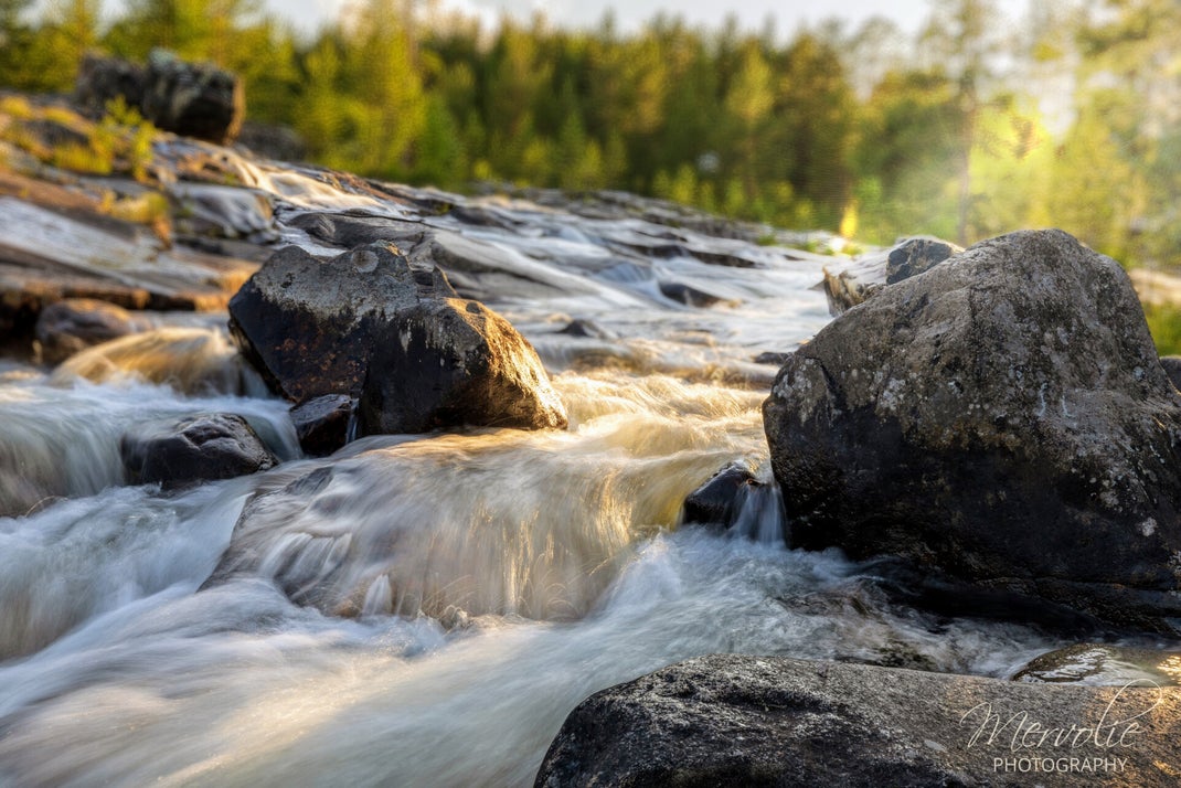 Landscape photography at Storforsen, Sweden, using long exposure to create silky water on a summer day.