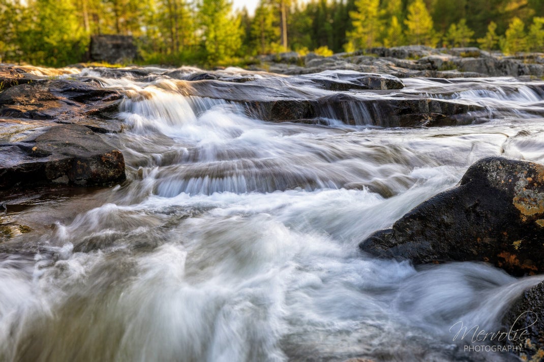 Landscape photography at Storforsen, Sweden, using long exposure to create silky water on a summer day.