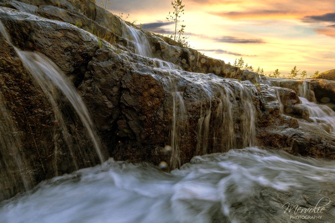 Landscape photography at Storforsen, Sweden, using long exposure to create silky water on a summer day.