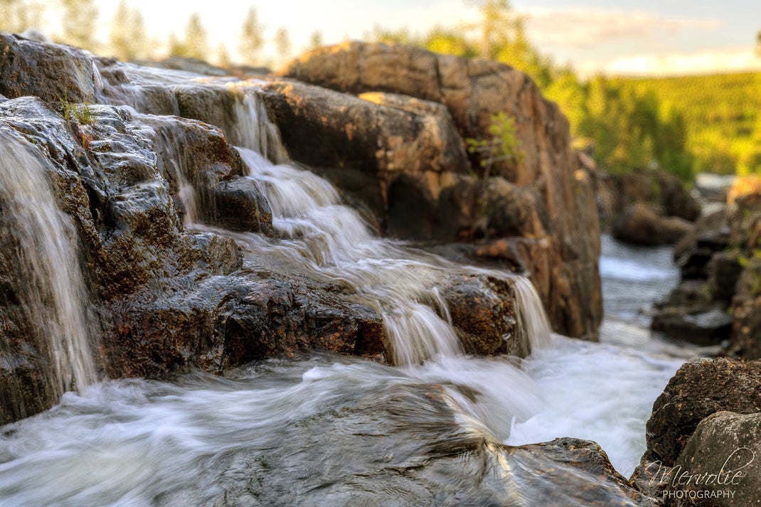 Landscape photography at Storforsen, Sweden, using long exposure to create silky water on a summer day.