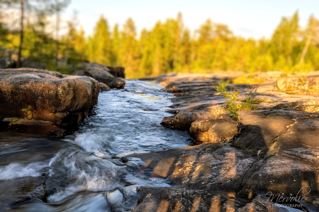 Landscape photography at Storforsen, Sweden, using long exposure to create silky water on a summer day.