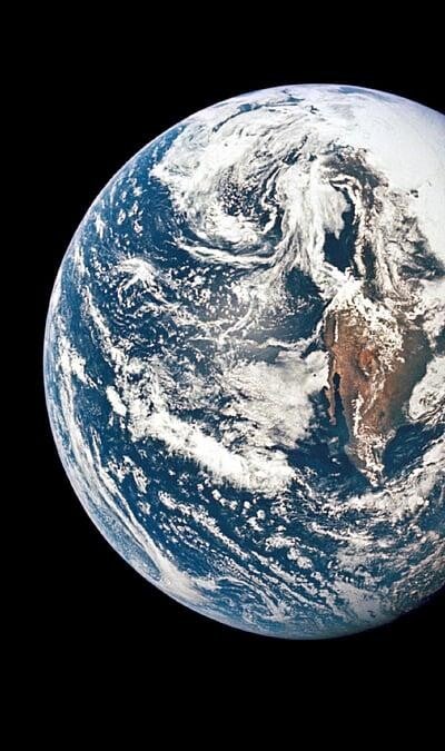 Earth viewed from space, protected within the Solar System.