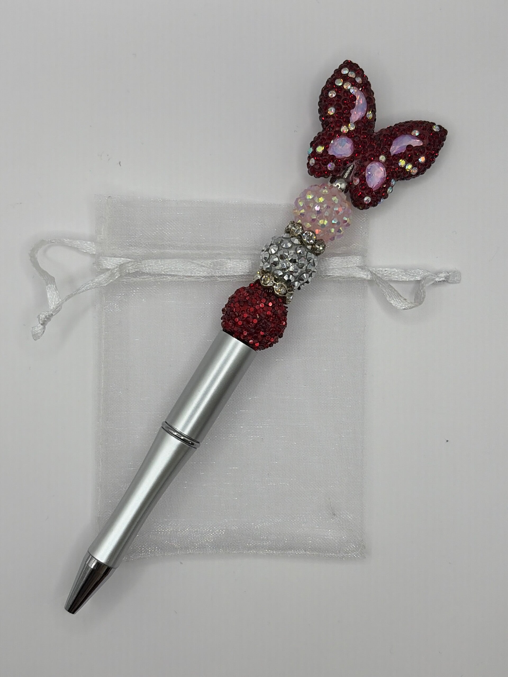 Pen zilverkleurig met rode glitter vlinder