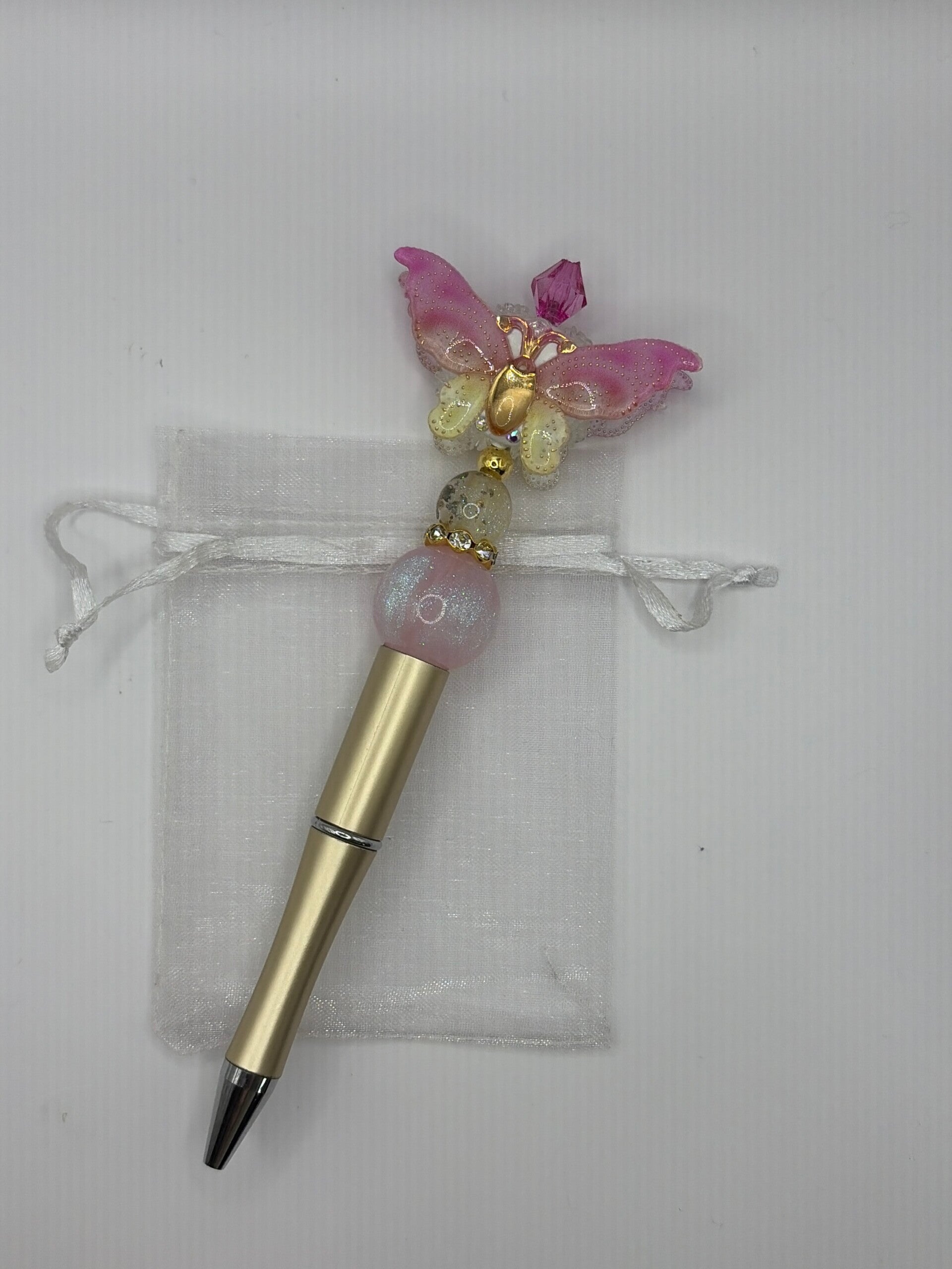 Pen mat goud met pastelkleurige vlinder