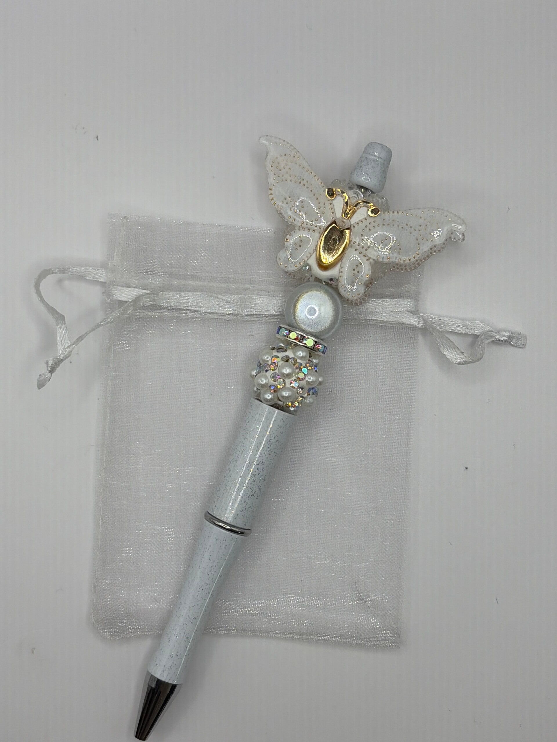 Pen glitter wit met grote vlinder wit/goud