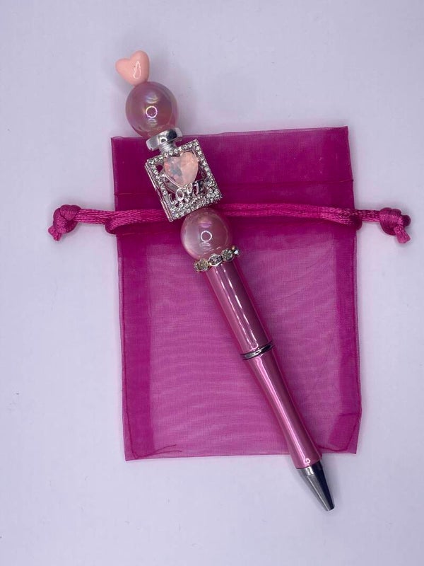 Pen roze met parfumflesje en hartje