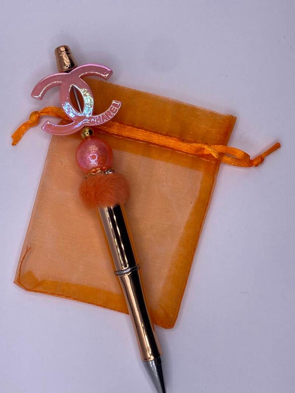 Pen oranje CC logo met Rose gouden pen