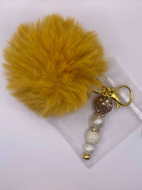 Sleutelhanger goud met pompom