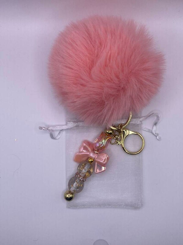 Sleutelhanger/tashanger met goud en zalm en pompom