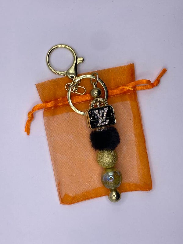 Sleutelhanger goudkleurig  LV tasje metallic goud
