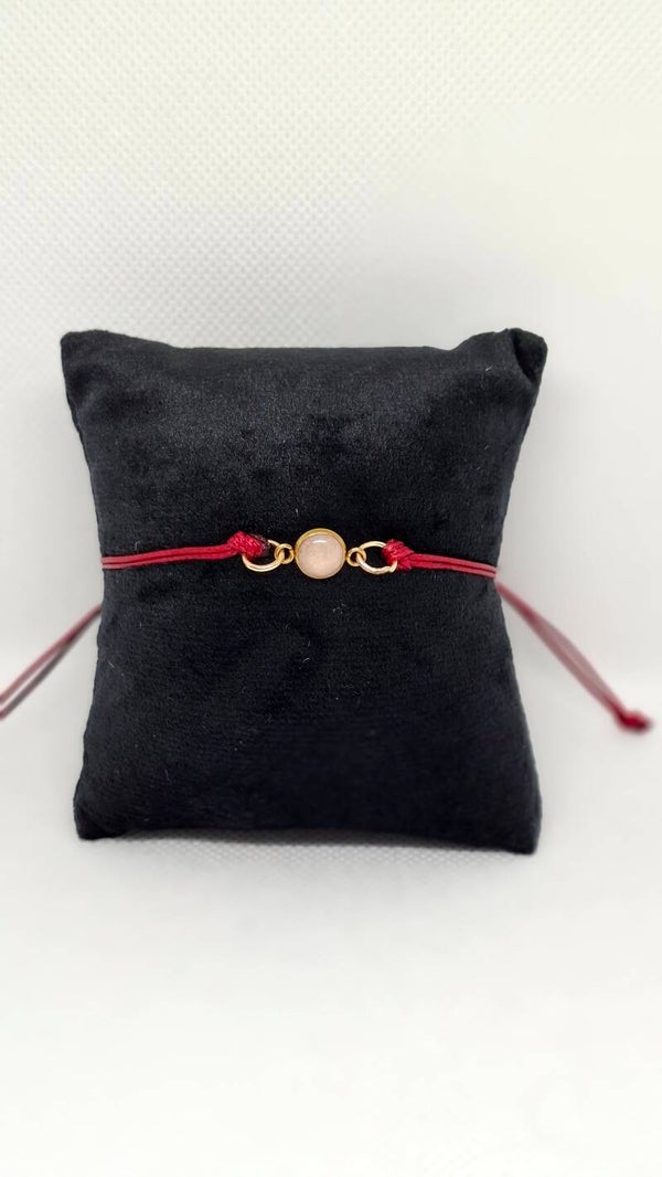 Armbandje gekleurd waxkoord met zilverkleurig bedeltje