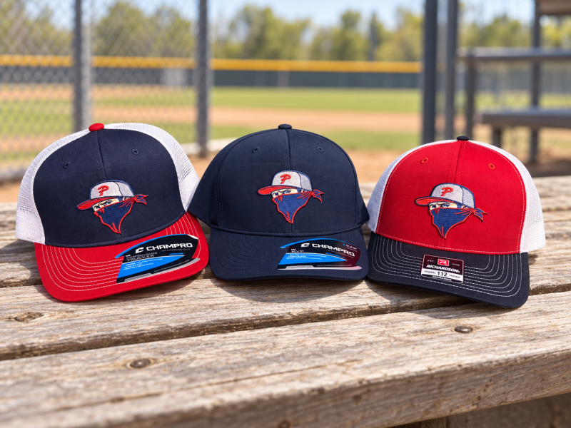 Custom embroidered baseball team hats in three color combinations
