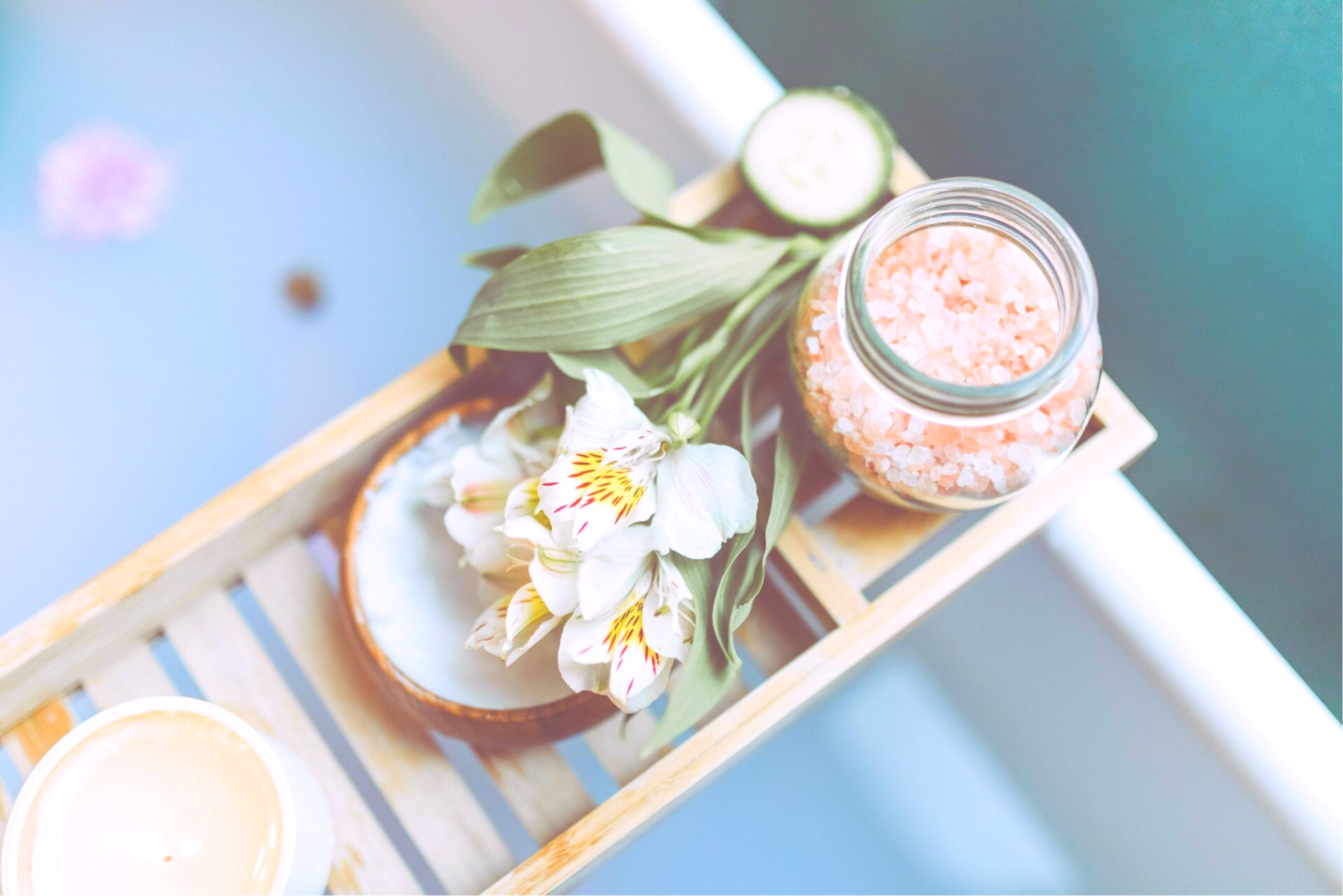 Relaxing facial and skincare treatment setup with flowers and spa products at Cat’s Esthetics & Lashes.