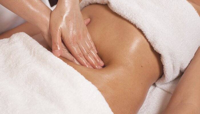 Professional Manual Lymphatic Drainage massage for post-operative recovery at L W Med Spa Massage in St. Cloud, FL. Gentle abdominal lymphatic drainage after Liposuction, Lipo 360, Tummy Tuck, BBL, Fat Transfer, and cosmetic surgery. Specialized Therapeut