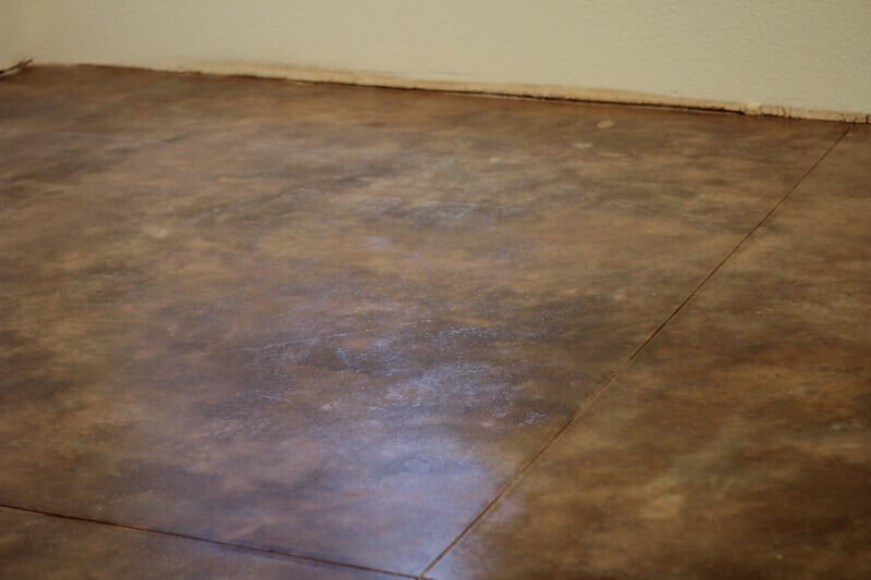 acid washed concrete creating brown and tan patterns on this concrete floor