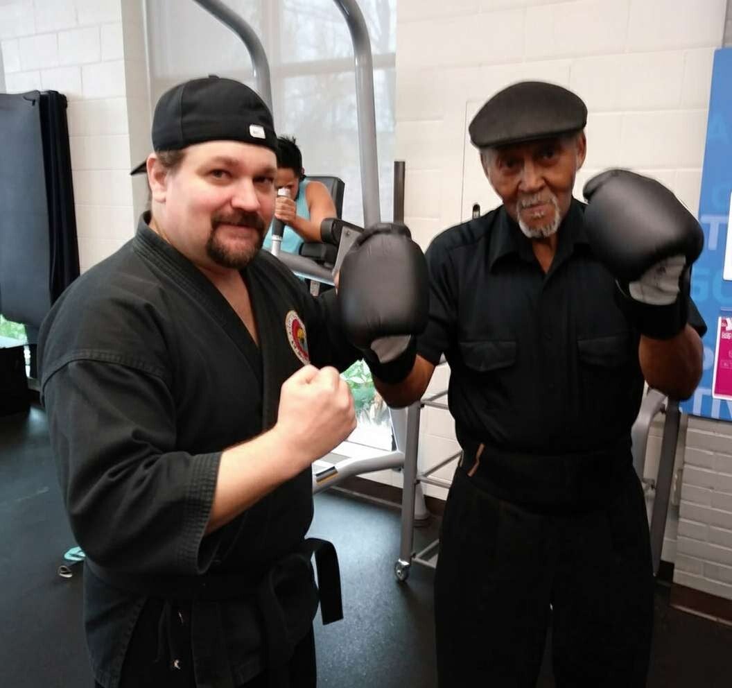 A picture of a personal trainer at Ninja Bob's Fitness working with a senior client 