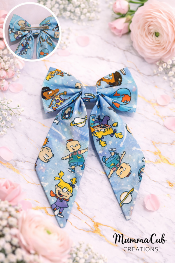 Large Baby Cartoon in Blue Hair Bow